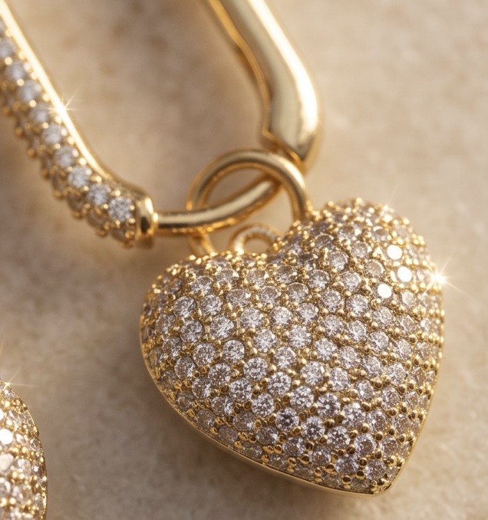 Endless Love - 1.7 carat pave White Topaz .925 Sterling Silver dipped in 18K Gold handmade Earrings - Close-up of heart-shaped pave white topaz pendant in gold setting.