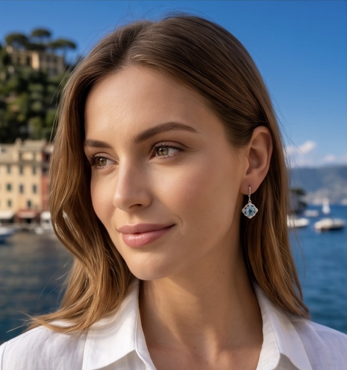 Atlantica - 4.7 carat Swiss Blue Topaz .925 Sterling Silver dipped in Rhodium Handcrafted Statement earrings - Woman wearing Atlantica earring with Swiss Blue Topaz, side view.
