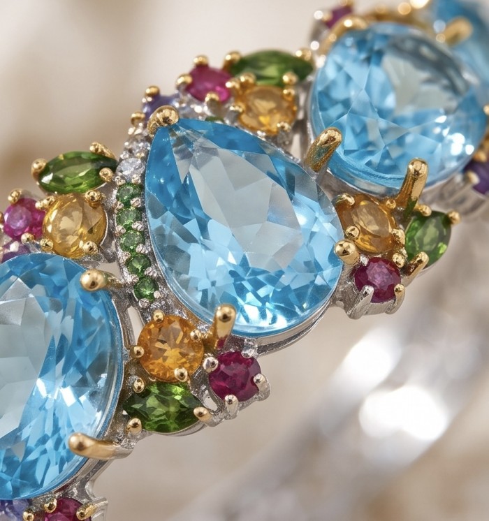 PACIFICA - 25.8 carat Swiss Blue Topaz 10.2 carat Sapphire 18K Rose Gold over .925 Sterling Silver handmade bangle Bracelet - Stone close-up of multi-gem ring with blue topaz and sapphire.