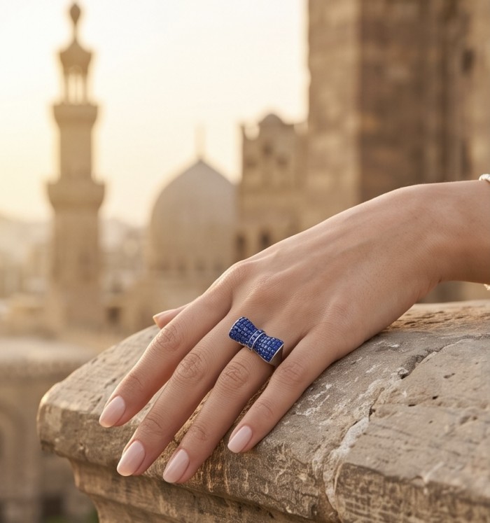 BLUE BOW - Iconic design- 22.2 carat natural pave Sapphire .925 Sterling Silver Perfectly handcrafted Ring s. 6 1/2 - Hand wearing BLUE BOW sapphire ring with architectural backdrop.