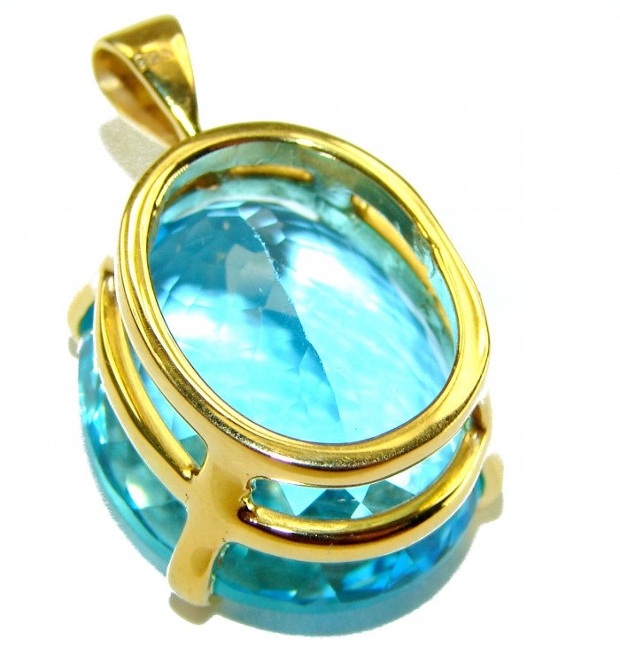 Atlantica oval cut 18.9 carat Swiss Blue Topaz 18K Gold over .925 Sterling Silver Handcrafted Pendant - Side view of Atlantica 18.9 carat Swiss Blue Topaz in 18K Gold setting