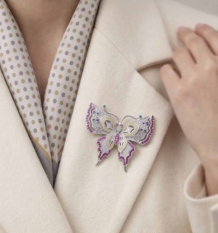 Vintage Design - Red Butterfly - Genuine 4.2 carat Ruby .925 Sterling Silver handmade Pendant Brooch - Butterfly brooch with rubies on beige coat, worn view.