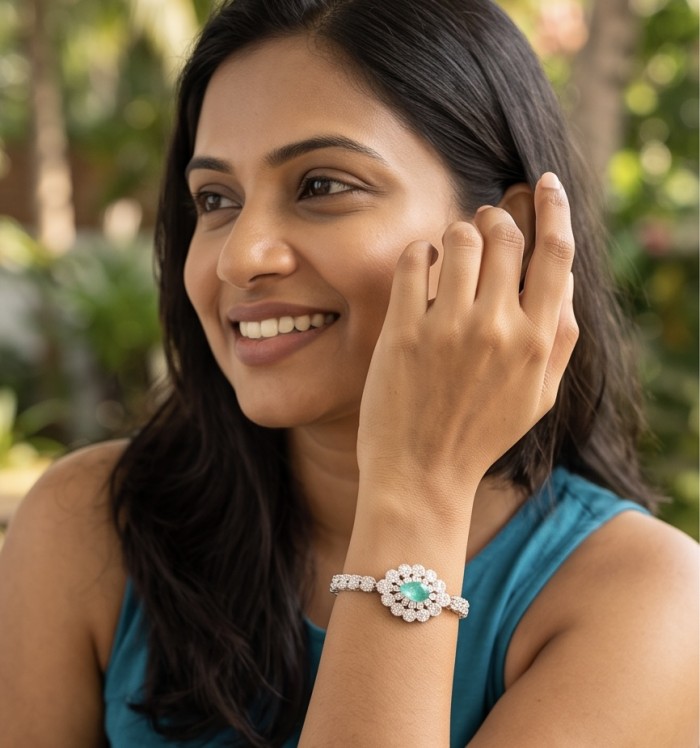 Estelle - Authentic 3.2 carat COLOMBIAN EMERALD .925 Sterling Silver handcrafted Statement Bracelet - Woman wearing bracelet featuring 3.2 carat Colombian emerald, side view.