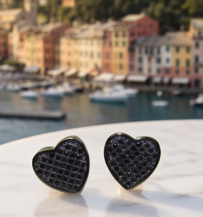 Simple Elegance Black Spinel .925 Sterling Silver dipped in black rhodium earrings - Heart-shaped black spinel cufflinks on marble surface with scenic background.