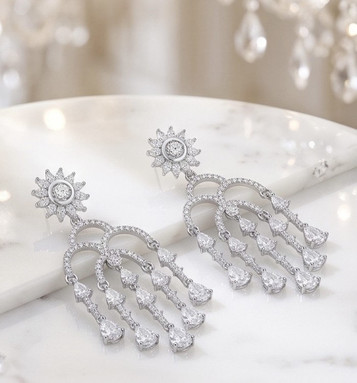 Classy Beauty Genuine 2.4 carat Moissanite .925 Sterling Silver handcrafted Earrings - Moissanite earrings on marble, top view, chandelier background.