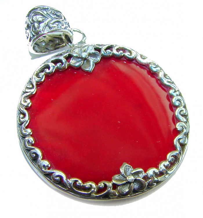 Bright Energy Authentic Coral .925 Sterling Silver Bali handmade pendant - Red coral pendant with floral silver detailing, front view.