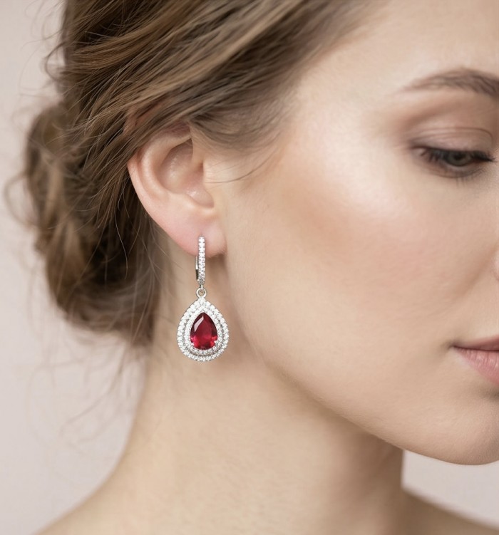 Exquisite 5.4 ctw Mozambique Ruby .925 Sterling Silver handcrafted Statement earrings - Side view of ruby and silver earring worn on ear.