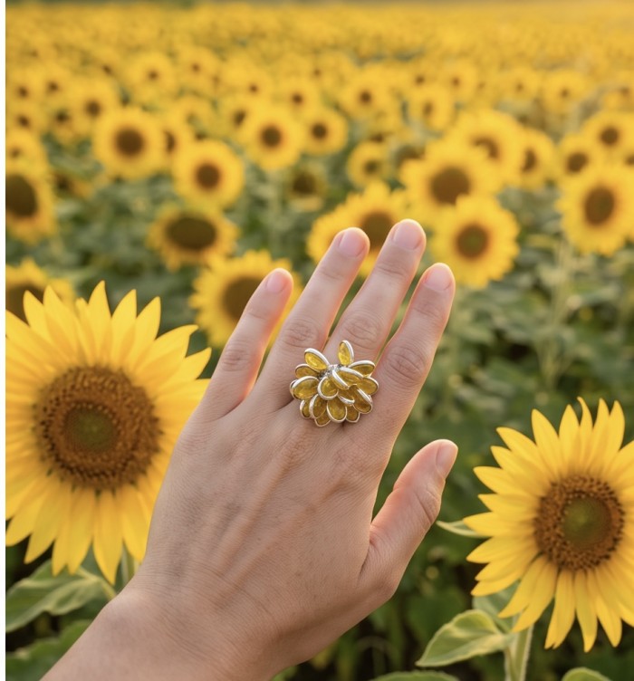 Authentic oval cut 18.2 carat Golden Topaz rhodium over .925 Sterling Silver cha- cha ring s. 6 - Sunflower ring worn on hand against a field of sunflowers.