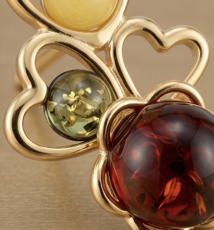 Golden Honey Hearts authentic Baltic Amber 14K Gold over .925 Sterling Silver earrings - Close-up of Baltic amber stones in heart-shaped 14K gold setting.