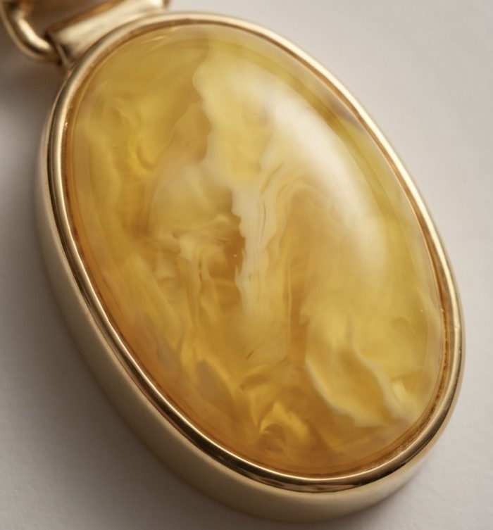 Prehistoric Authentic Golden Butterscotch Baltic Amber 18K Gold over .925 Sterling Silver beautifully handcrafted Pendant - Close-up of golden butterscotch Baltic amber in 18K gold setting.