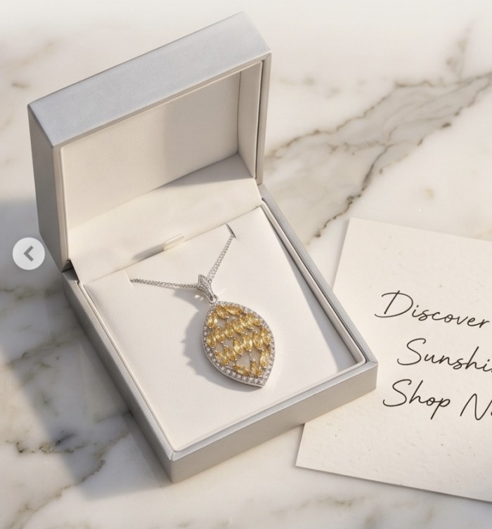 Authentic 15.5 carat Brazilian Citrine rhodium over .925 Sterling Silver handcrafted Statement Pendant - Pendant in box, top view, showcasing citrine stones and chain detail.