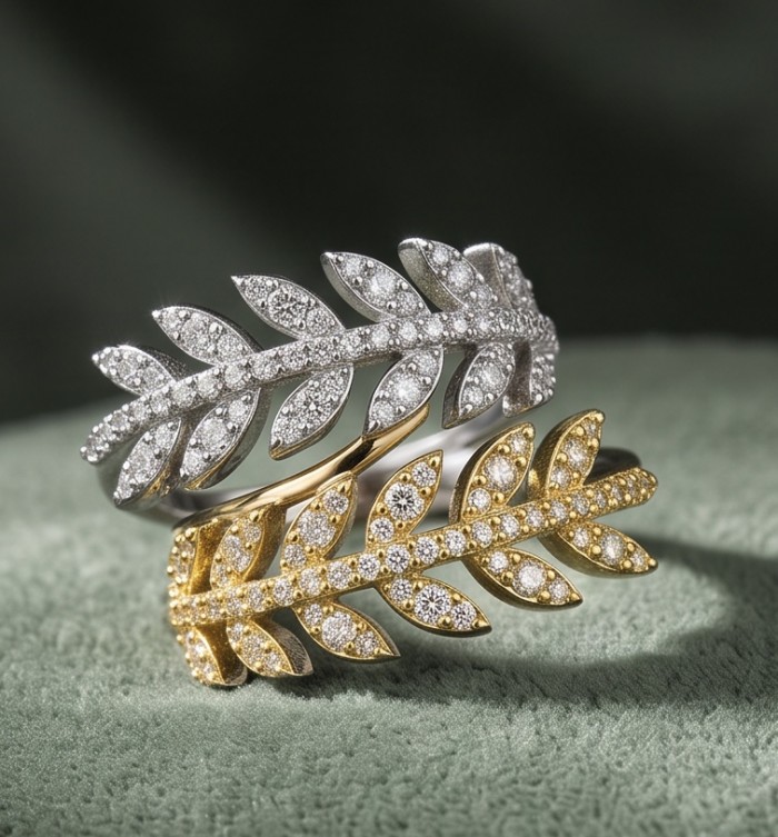 Real Beauty - 2.5 carat White Topaz 2 tones .925 Sterling Silver Handcrafted Statement Ring size 8 - Two leaf-design rings in gold and silver with white topaz, side view.