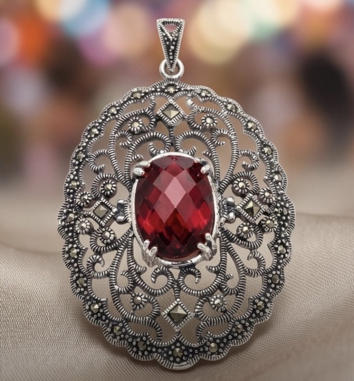 Vintage Style - Precious - Genuine 14.5 carat Ruby Marcasite Rhodium over .925 Sterling Silver handmade Pendant - Vintage-style ruby necklace close-up with intricate silver detailing.