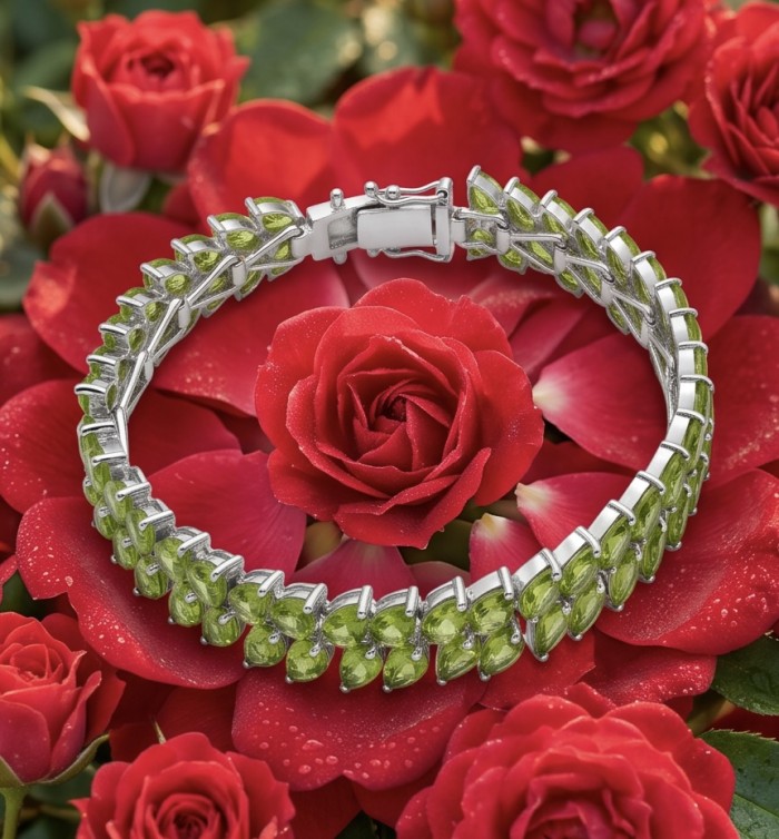 Vittoria Natural 44.8 carat Brazilian Peridot Rhodium over .925 Sterling Silver handmade Statement Bracelet - Peridot bracelet on red roses, top view showcasing details.