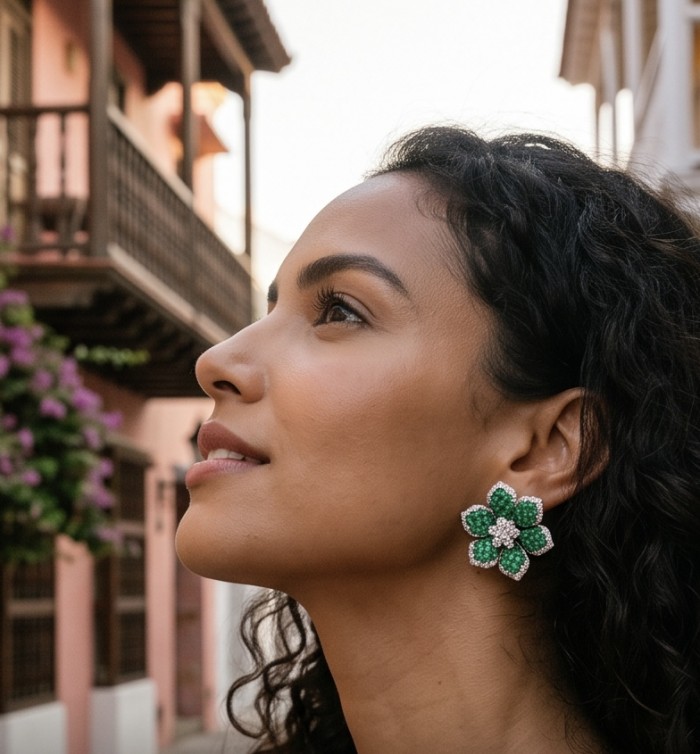Born to Glam authentic 18.7 carat mystery setting Colombian Emerald .925 Sterling Silver handcrafted Statement earrings - Side view of woman wearing green floral earrings with diamond accents.
