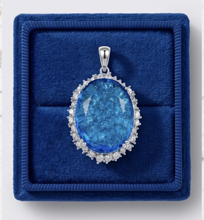 Angelina 10.9 carat authentic Swiss Blue Topaz .925 Sterling Silver Handcrafted handmade Pendant - Oval blue topaz pendant in box, top view, with sterling silver setting.
