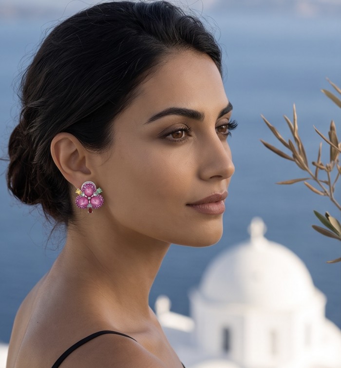 Exotic Flowers - 10.8 carat Mozambique Ruby .925 Sterling Silver dipped in rhodium handmade Statement Earrings - Side view of earrings featuring Mozambique rubies with ocean background