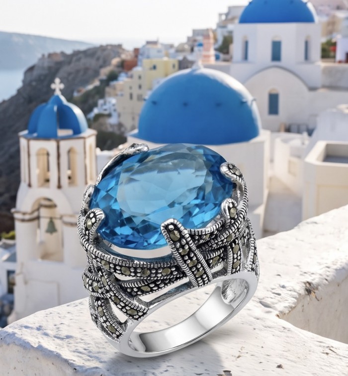 Poseidon 23.8 carat Swiss Blue Topaz .925 Sterling Silver handcrafted Large ring size 7 - Close-up of Swiss Blue Topaz ring on white stone background.