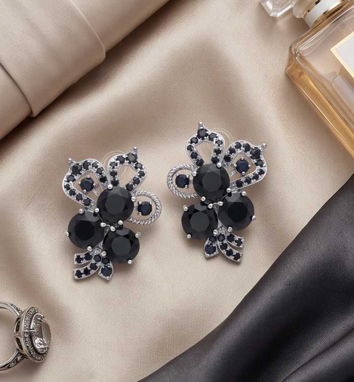 Vintage Style 14.7 carat Sapphire Rhodium over .925 Sterling Silver handcrafted earrings - Vintage Sapphire Earrings top view on fabric background