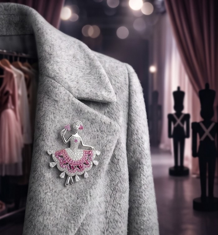 Ballerina - Precious 8.2 carat Colombian Ruby rhodium over .925 Sterling Silver handmade Pendant - Brooch - Ballerina brooch with Colombian rubies on a grey coat, stage backdrop.
