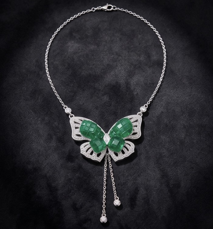 Precious Butterfly authentic mystery setting 12.9 carat Colombian Emerald .925 Sterling Silver handcrafted Statement necklace - Butterfly necklace with emerald stones and diamond accents on dark background.