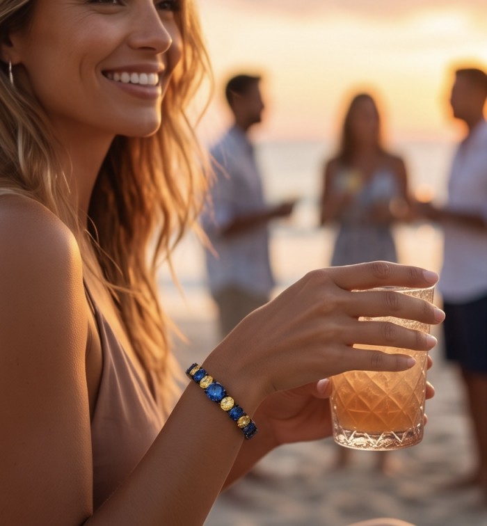 7.8 carat yellow Sapphire 9.2 carat Sapphire black rhodium over over .925 Sterling Silver handmade bangle Bracelet - Bracelet worn on wrist at sunset, showcasing sapphires and black rhodium