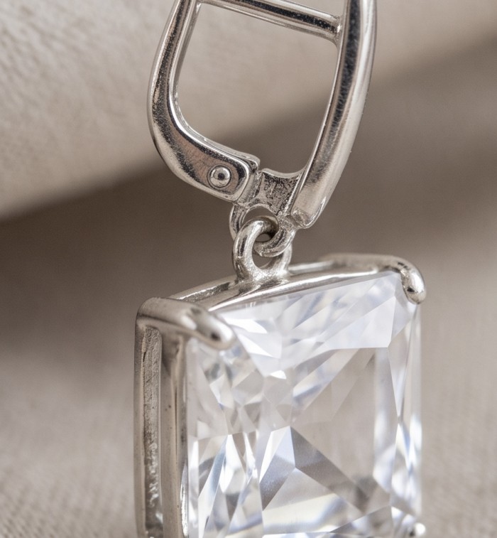 Angelina asscher cut 14.9 carat authentic White Topaz .925 Sterling Silver Handcrafted Earrings - Close-up of asscher cut white topaz and clasp detail.
