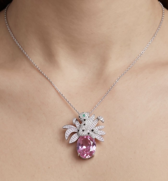 Pink Cheetah authentic 12.5 carat Pink Sapphire .925 Sterling Silver Handcrafted pendant brooch - Necklace with pink sapphire pendant worn on neck, front view.