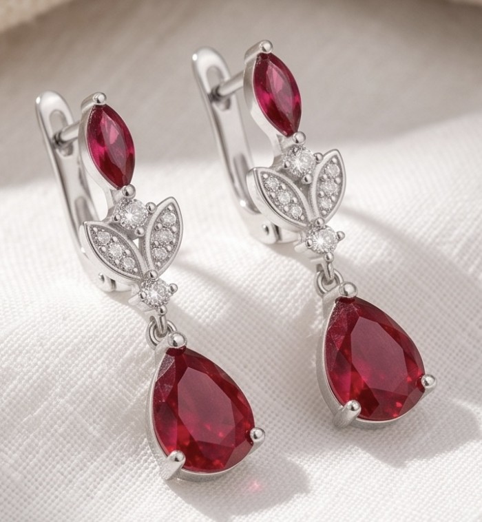 Giovanna - Magnificent Jewel 4.2 carat Ruby .925 Sterling Silver handcrafted incredible Statement earrings - Elegant ruby and silver earrings, front view on white fabric background.