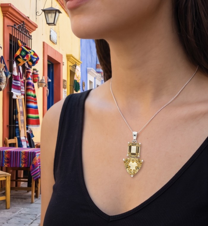 Vivien - Natural 17.2 carat Citrine .925 Sterling Silver dipped in Rhodium handmade pendant - Close-up of Vivien Citrine necklace worn, colorful street background