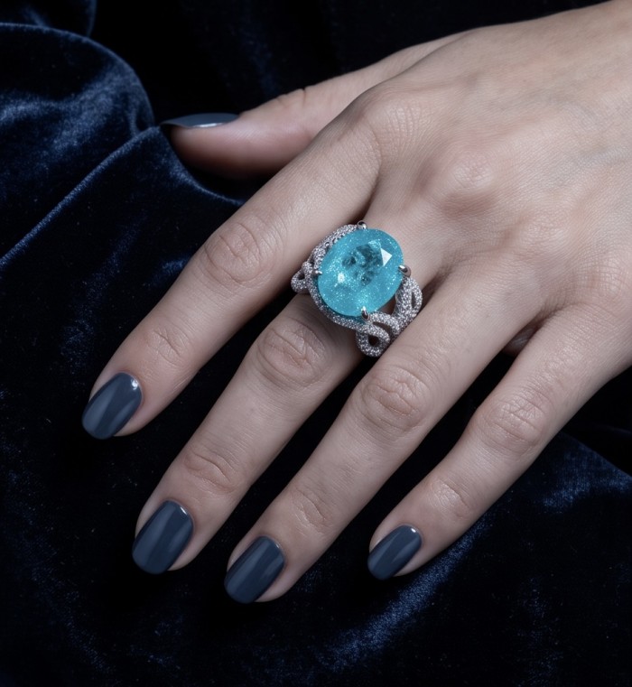Oceania 14.5 carat Paraiba Tourmaline .925 Sterling Silver Handcrafted Ring size 7 1/2 - Paraiba Tourmaline ring worn on hand, dark nails, blue velvet background.