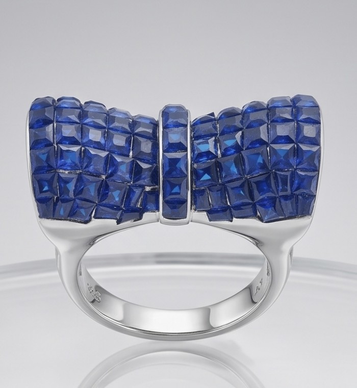 BLUE BOW - Iconic design- 22.2 carat natural pave Sapphire .925 Sterling Silver Perfectly handcrafted Ring s. 6 1/2 - Close-up of blue bow ring with pave sapphires, front view.