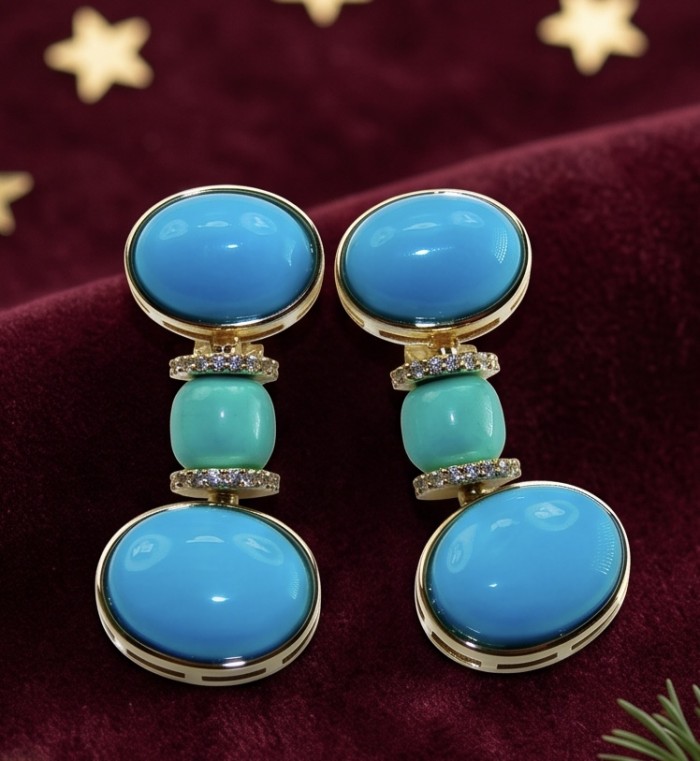 Pacifica - 35.4 carat Sleeping Beauty Turquoise 18K Gold .925 Sterling Silver handmade Statement Earrings - Close-up of Pacifica Sleeping Beauty Turquoise earrings on velvet backdrop