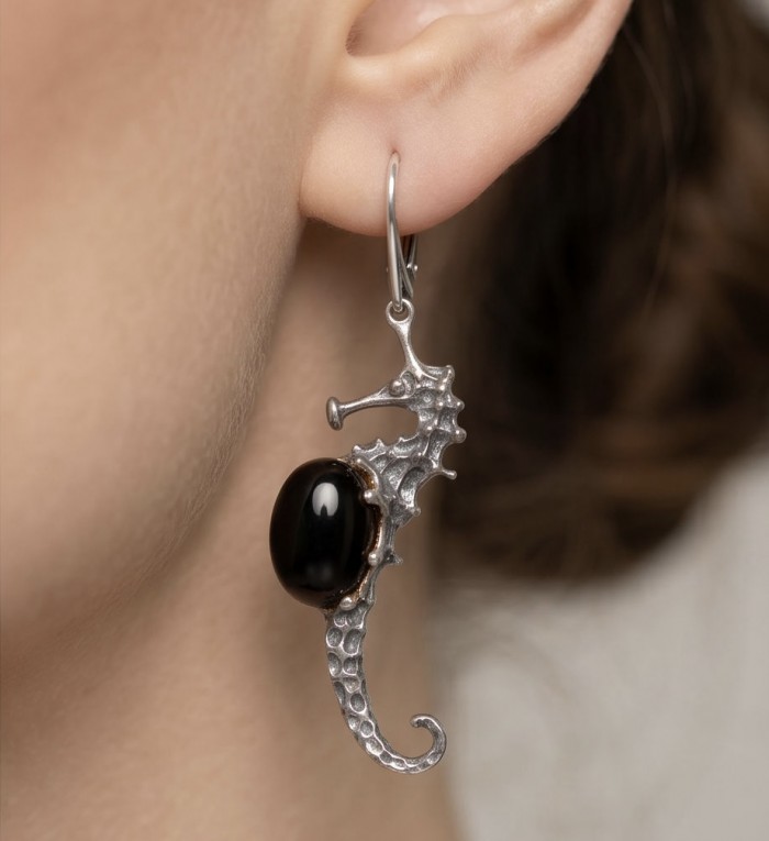 SEAHORSE Style genuine green Baltic Amber .925 Sterling Silver earrings - Seahorse earring with black stone, side view, worn on ear.