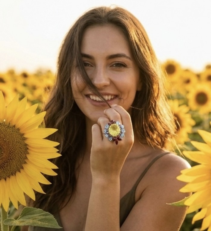 Isabel 18.8 carat Genuine Lemon Quartz Chroem rhodium over .925 Sterling Silver handcrafted ring size 8 - Lemon quartz ring worn on hand in a sunflower field close-up.