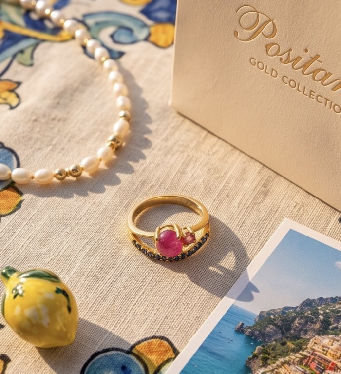 Scarlett 0.7 ctw Mozambique Ruby .925 Sterling Silver handcrafted Statement Ring size 8 - Ruby ring and pearl necklace on table with Positano label and postcard