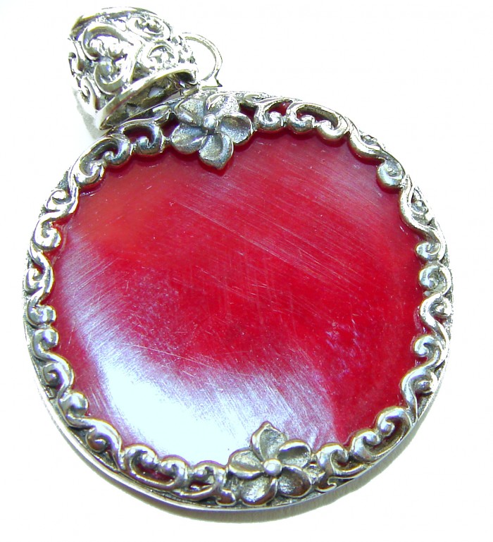 Bright Energy Authentic Coral .925 Sterling Silver Bali handmade pendant - Close-up of coral pendant with floral silver detailing.