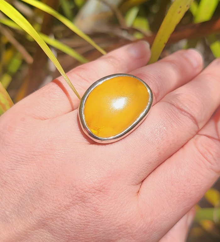 Authentic Golden Butterscotch Baltic Amber .925 Sterling Silver entirely handcrafted ring; s. 7 adjustable - Golden butterscotch amber ring worn on hand, close-up.