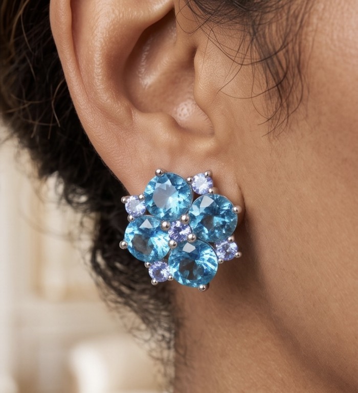 Petal 4.7 carat Swiss Blue Topaz .925 Sterling Silver Handcrafted earrings - Close-up of Swiss Blue Topaz earring worn on ear