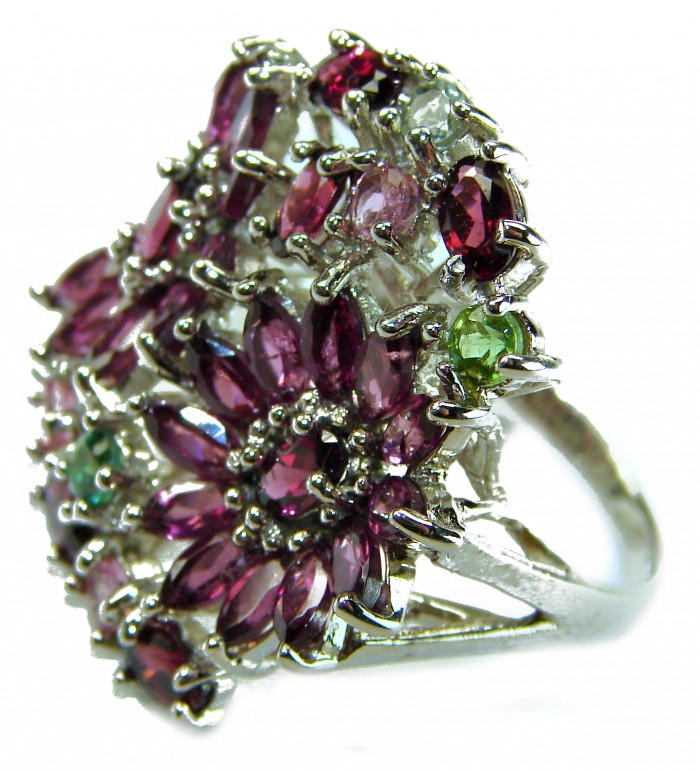 Summer Time 25.5 carat Red Garnet .925 Sterling Silver handcrafted ring; s. 8 - Close-up of red garnet ring with green accents on sterling silver.
