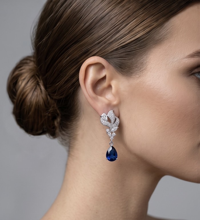 Blue Royalty 3.7 carat Sapphire .925 Sterling Silver handcrafted Statement earrings - Side view of Blue Royalty sapphire earrings on model's ear