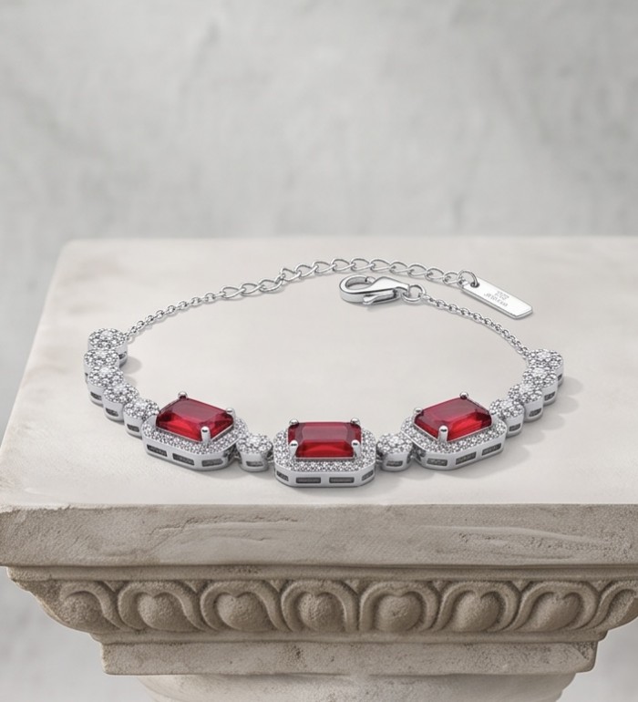 Serafina - Magnificent Jewel 9.8 carat Ruby .925 Sterling Silver handcrafted incredible Statement Bracelet - Elegant ruby bracelet on marble stand, showing front view.