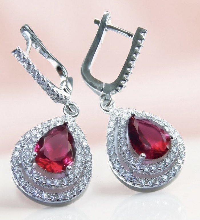 Exquisite 5.4 ctw Mozambique Ruby .925 Sterling Silver handcrafted Statement earrings - Close-up of earrings with Mozambique rubies and sterling silver.