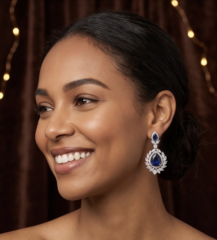 Vintage style - Giovanna - Authentic pear cut 8.9 carat Sapphire .925 Sterling Silver handcrafted earrings - Side view of vintage-style earrings with 8.9 carat sapphire worn by model.