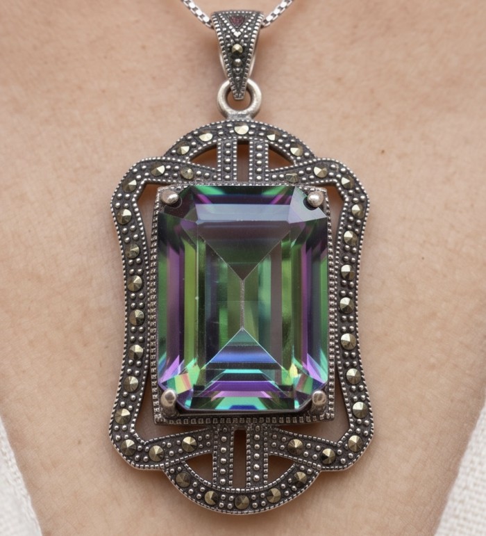 Spectacular 14.2 cut Mystic Topaz Marcasite .925 Sterling Silver handcrafted Pendant - Mystic Topaz Marcasite Sterling pendant close-up, worn on skin.