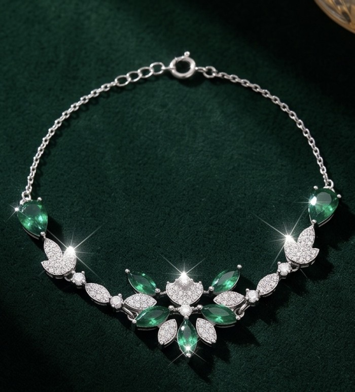 Giovanna - Authentic 6.2 carat Colombian Emerlad .925 Sterling Silver handcrafted Statement bracelet - Colombian emerald necklace on green velvet, top view.