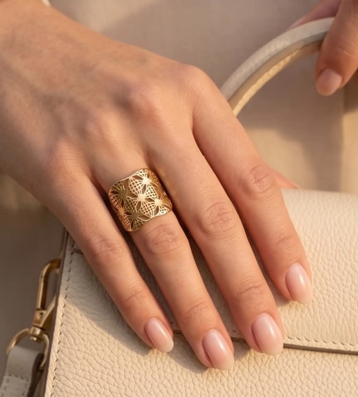 Dubai Style .925 Sterling Silver dipped in 22K Gold handmade Large ring size 9 - Dubai Style gold-plated silver ring worn on hand with beige purse.