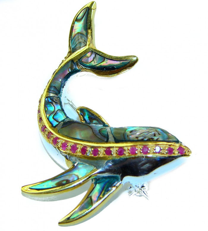 Dolphin Natural Rainbow Abalone Ruby .925 Sterling Silver handmade Pendant Brooch - Dolphin-shaped jewelry with abalone and ruby detail, top view.
