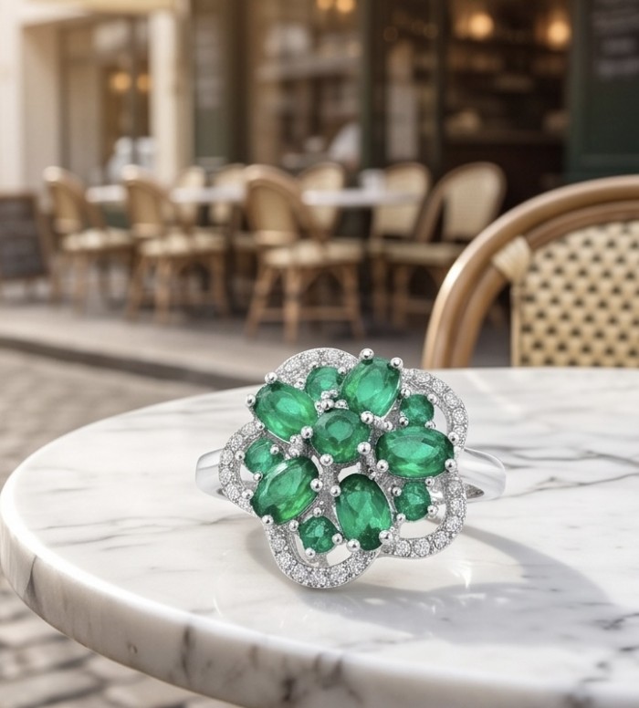 Blooming Spring 6.5 carat Chrome Diopside .925 Sterling Silver handcrafted ring size 6 - Front view of Blooming Spring ring with green stones on table.