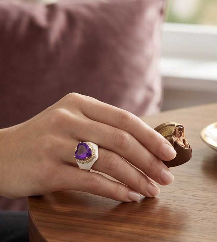 Lavender Love 10.5 carat natural Amethyst Enamel 22K Gold over .925 Sterling Silver Handcrafted Ring size 7 1/2 - Ring with amethyst worn on hand, holding a chocolate truffle.